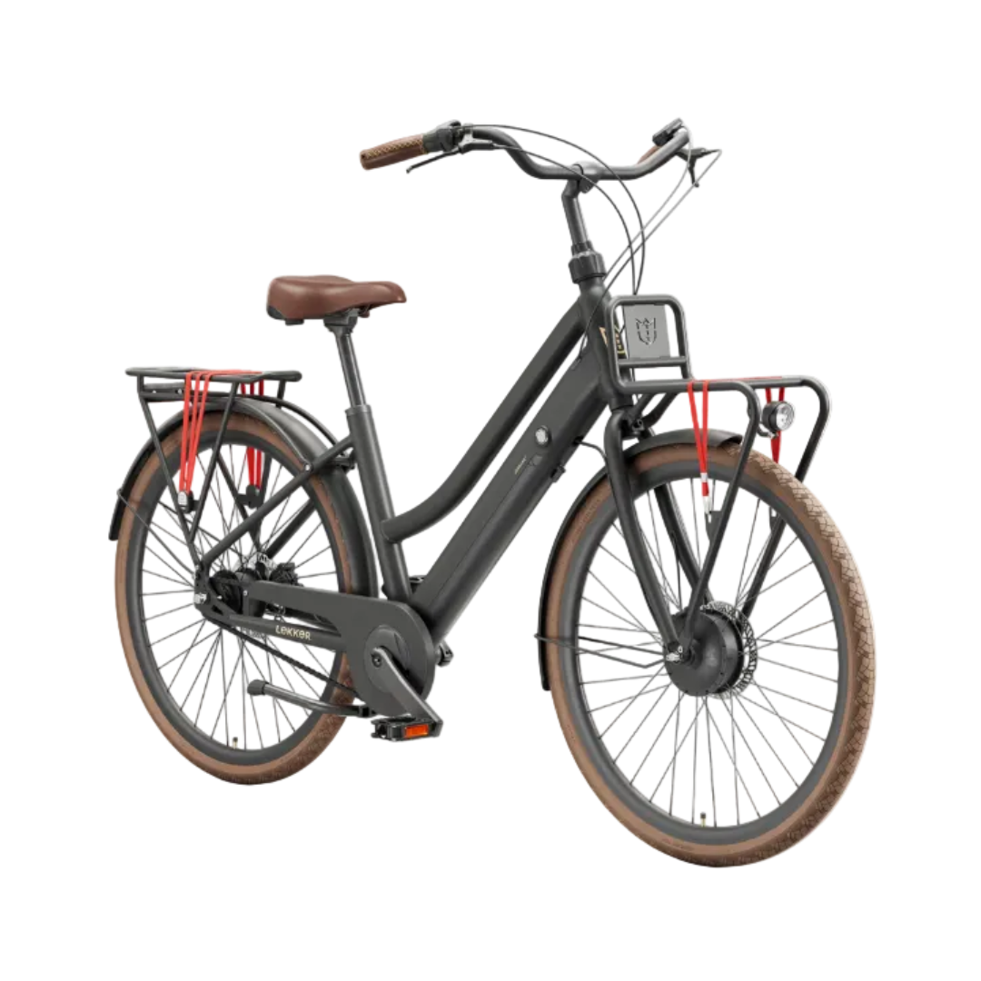 A step-through electric bicycle in matte dark gray with brown leather saddle and tires, featuring a front basket, rear cargo rack, and red lock straps, shown against a plain white background.