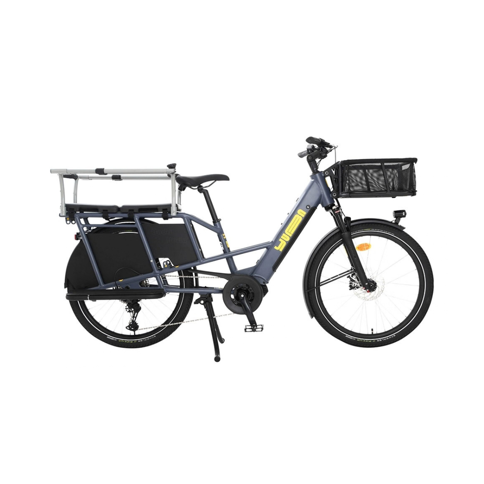 A dark gray Yuba electric cargo bike with a black rear cargo box, a front basket, and a silver step-through rack, shown against a plain white background.